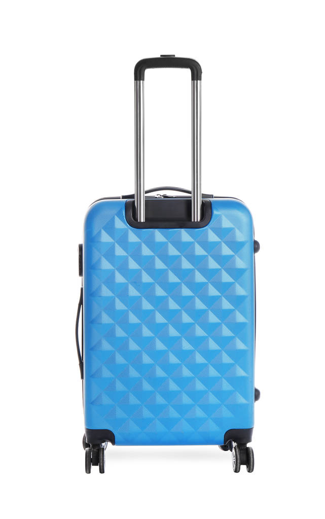 Sininen matkalaukku valkoisella pohjalla matkustamiseen
 - Valokuva, kuva