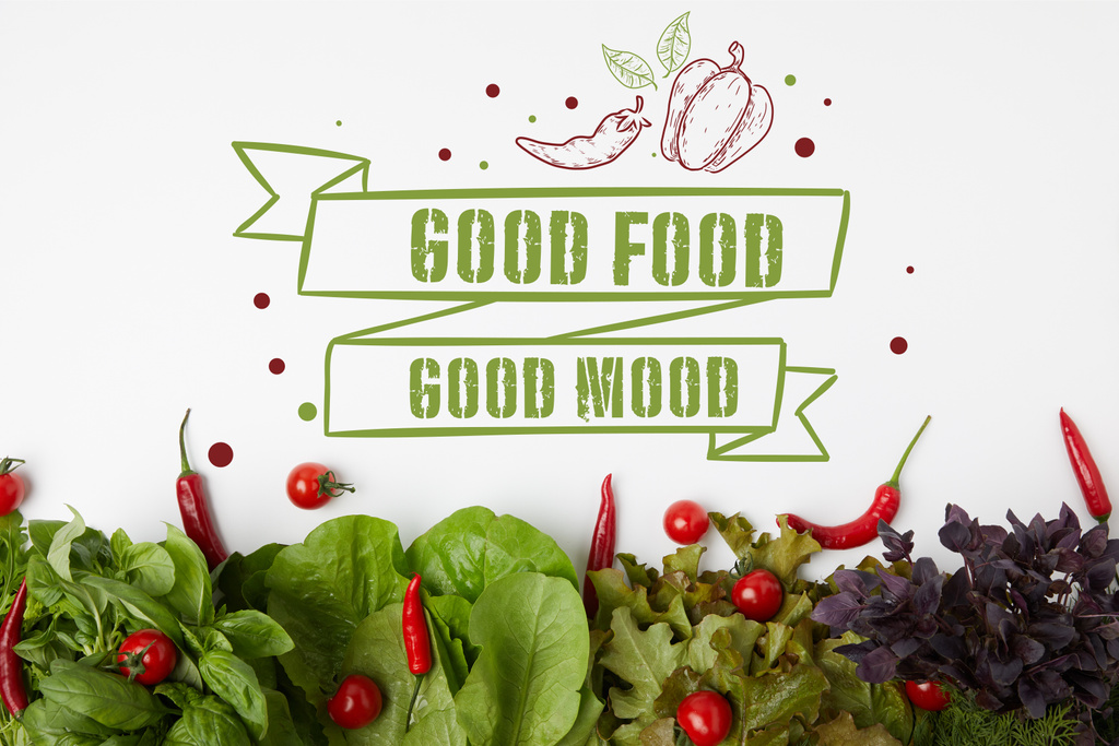 vista superior de várias verduras de folha frescas com tomates e pimentas na superfície branca com "boa comida - bom humor" inspiração
 - Foto, Imagem