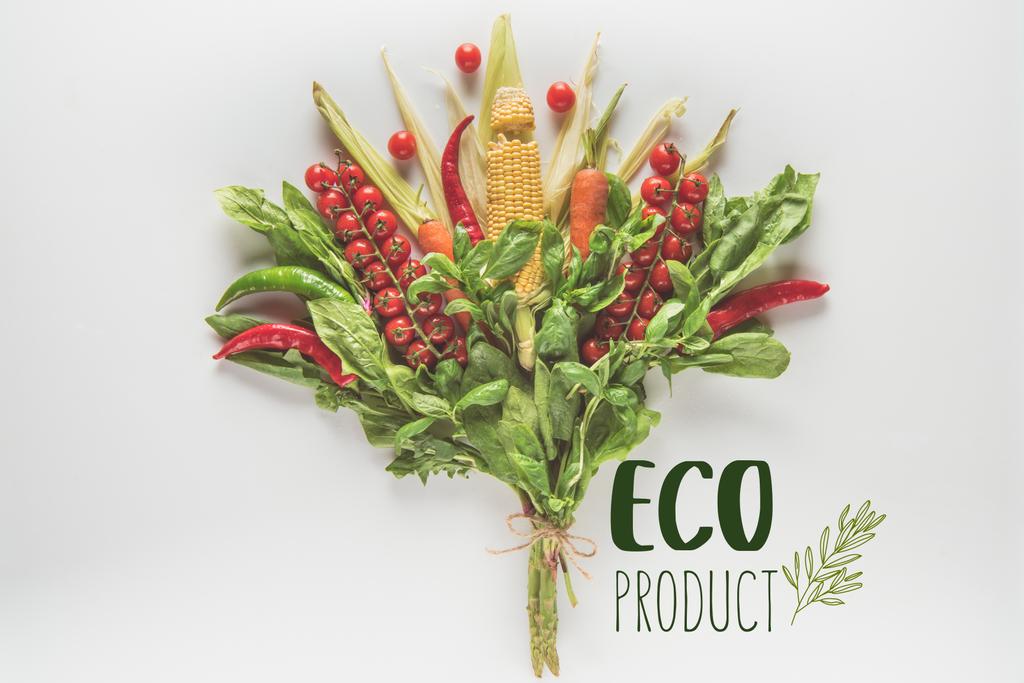 bouquet of corn cob, spinach, basil, cherry tomatoes and chili peppers isolated on white with "eco product" lettering - Photo, Image