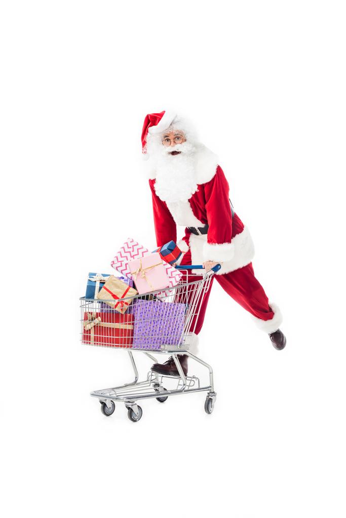 Joulupukki kuljettaa vaunu kasa lahjapakkauksia eristetty valkoisella pohjalla
 - Valokuva, kuva