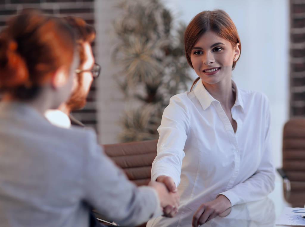 business woman greets the employee with a handshake, - Photo, Image