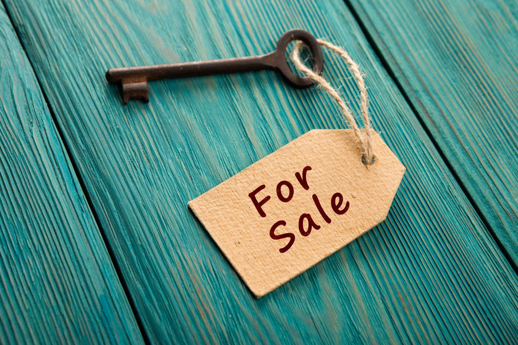 real estate sale concept - old key with tag - Photo, Image