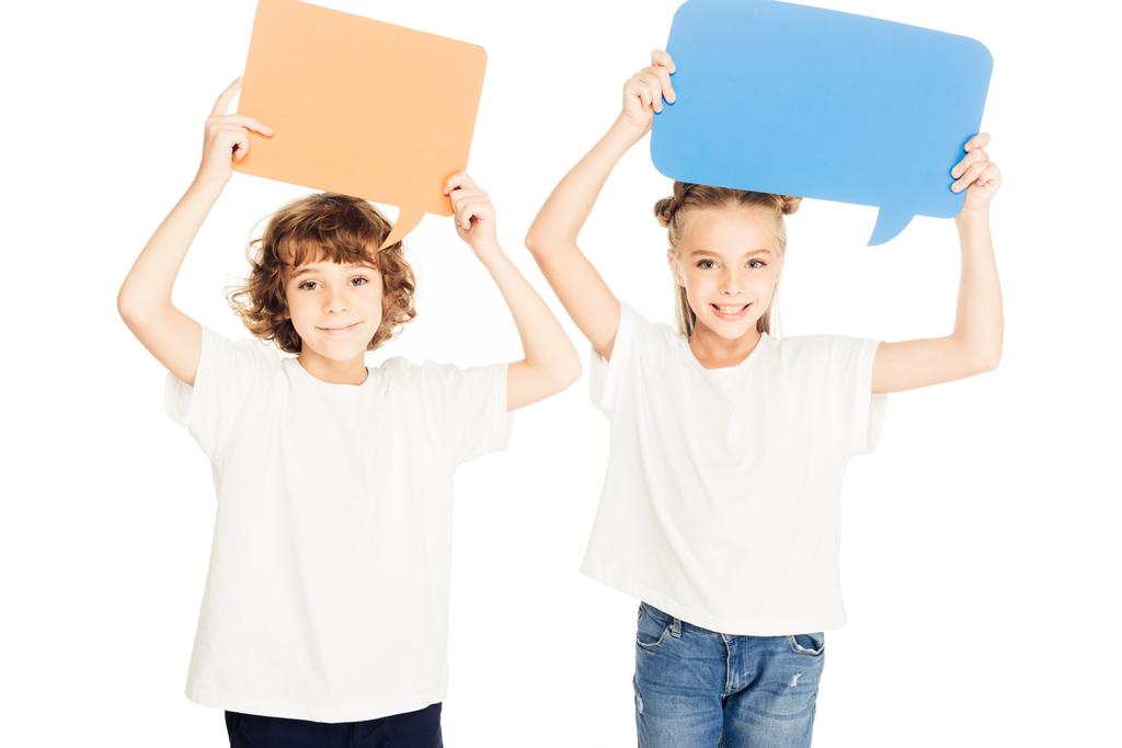adorable smiling children holding paper speech bubbles above heads isolated on white - Photo, Image