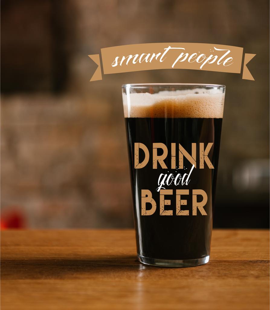 close-up view of glass with delicious dark beer on table in pub with "smart people drink good beer" inspiration - Photo, Image