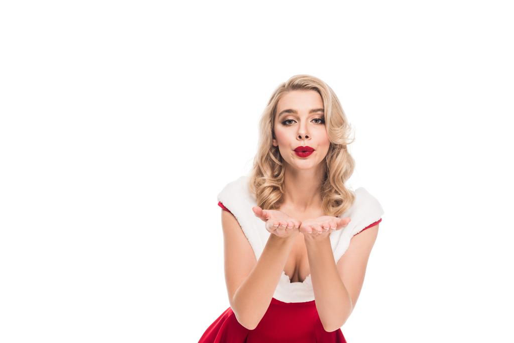 attractive santa girl in christmas dress blowing air kiss isolated on white - Photo, Image