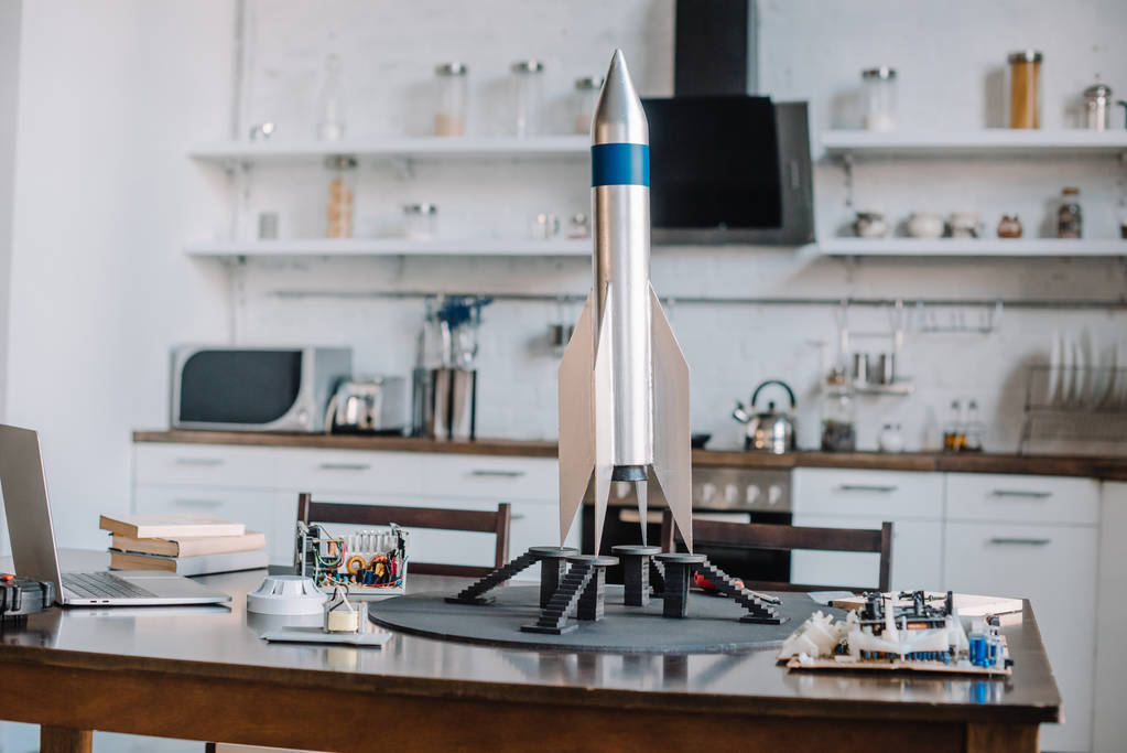 rocket model and tools for engineering on table in kitchen - Photo, Image