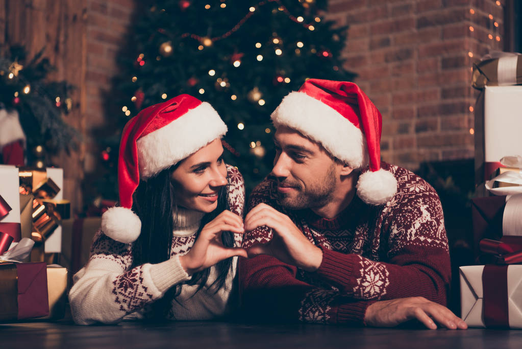 Brunette lady and handsome man in ornament sweater and headwear  - Photo, Image