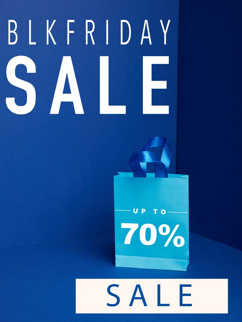 close up view of paper shopping bag on blue with blkfriday and 70 percents sale - Photo, Image