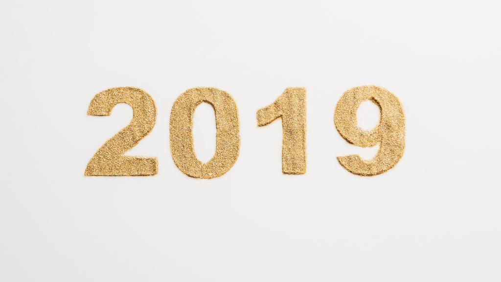 top view of 2019 year sign made of golden glitters isolated on white  - Photo, Image