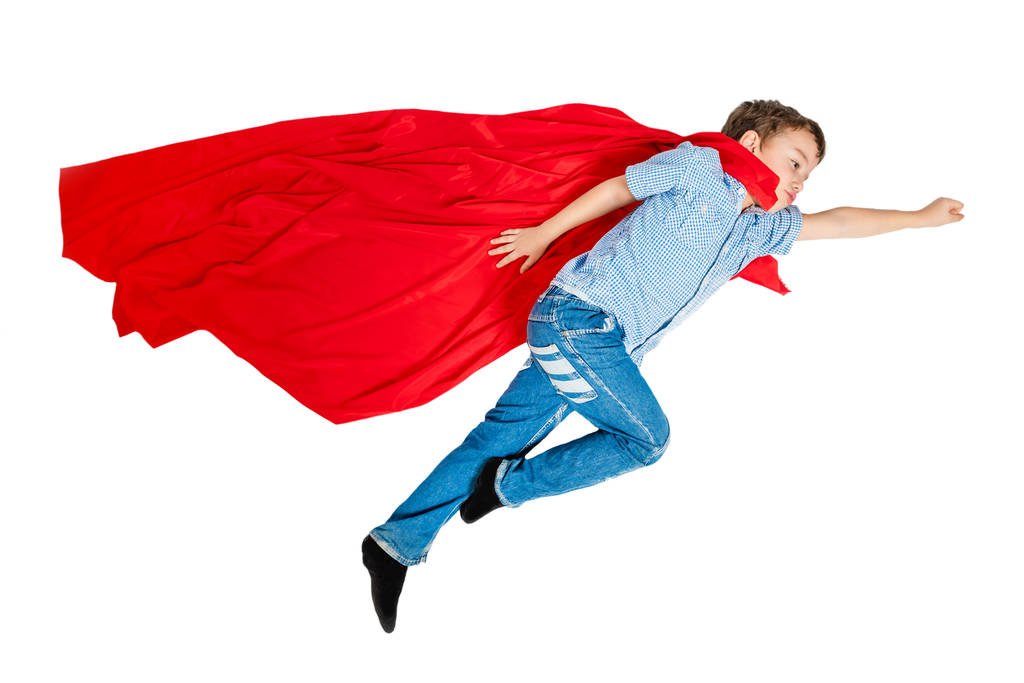 Chlapec v červený plášť, který superhrdina létání na bílém pozadí. Izolovaný - Fotografie, Obrázek