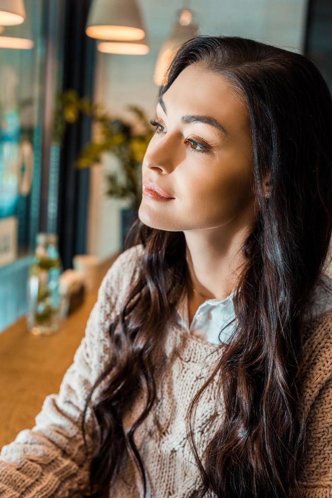 beautiful brunette woman in autumn sweater in cafe - Photo, Image