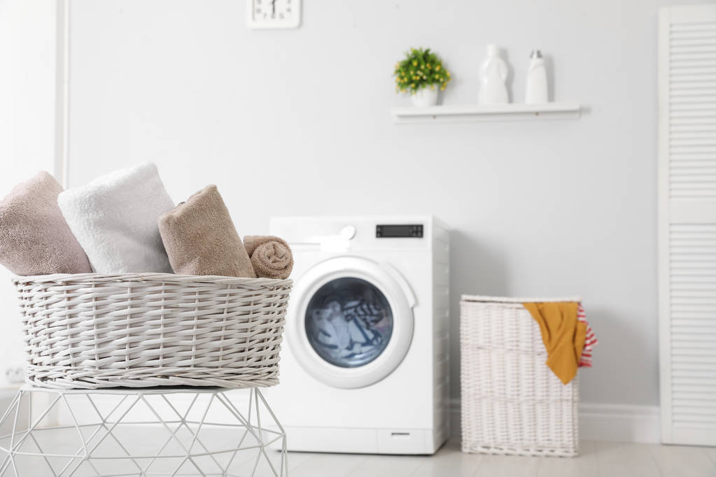 Basket with laundry and washing machine on background. Space for text - Photo, Image