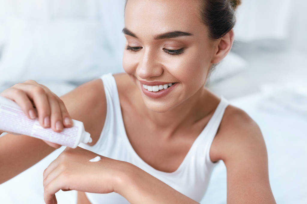 Hand Skin Care. Beautiful Woman Applying Cream On Hands Skin - Photo, Image
