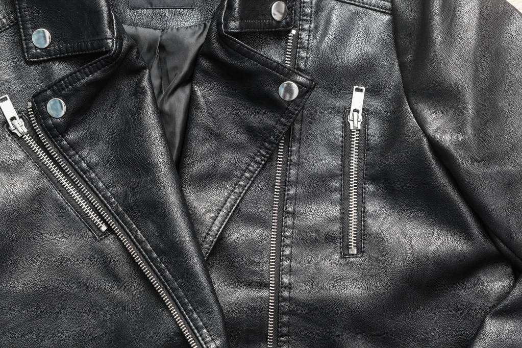 крупним планом чорна шкіряна куртка
 - Фото, зображення