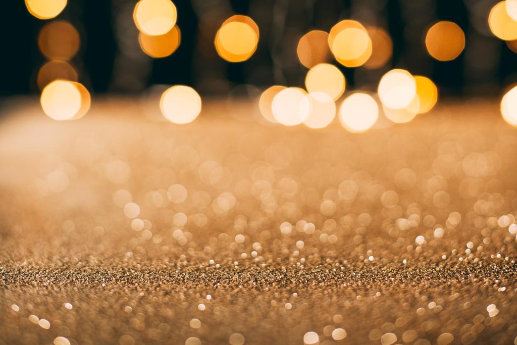 lentejuelas brillantes doradas con bokeh en el fondo, concepto de Navidad
 - Foto, imagen