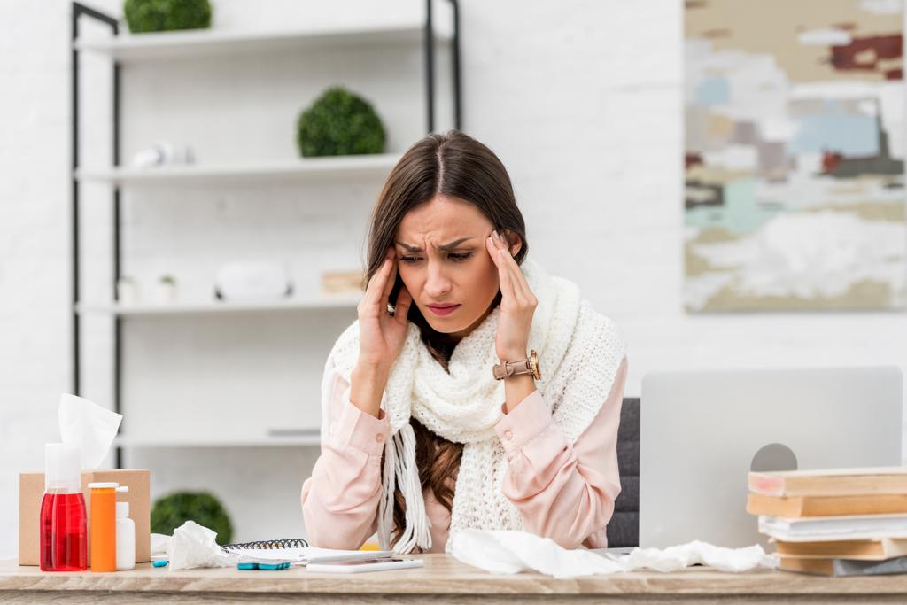 sick young businesswoman suffering from headache at workplace - Photo, Image