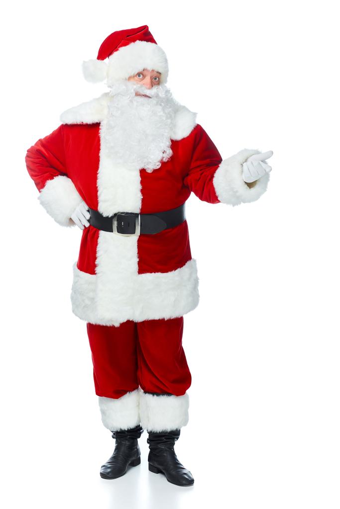 überrascht Weihnachtsmann zeigt etwas isoliert auf weiß - Foto, Bild