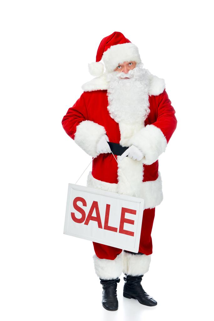 Babbo Natale Holding Board con cartello di vendita rosso isolato su bianco
 - Foto, immagini