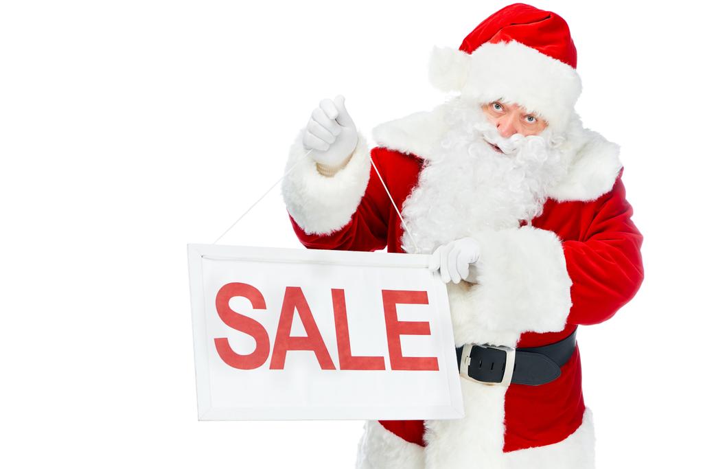 santa claus holding discount board with sale sign isolated on white - Photo, Image