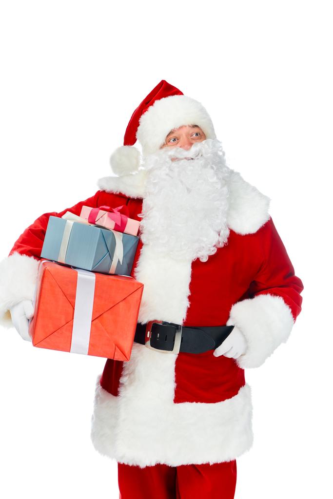 Santa Claus pensativo con regalos de Navidad aislados en blanco
 - Foto, imagen