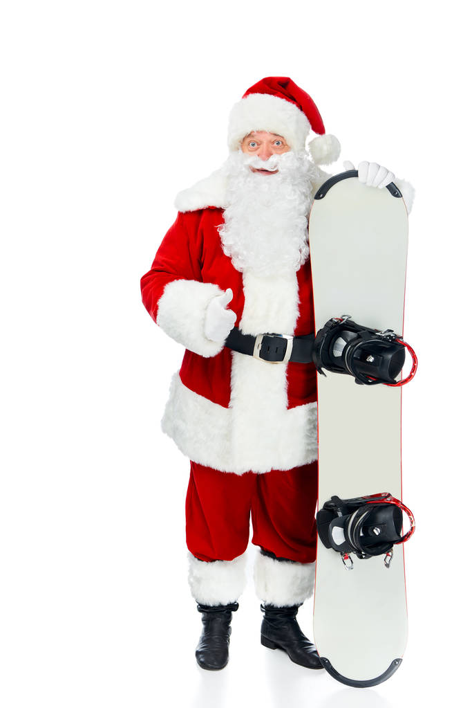 Санта-Клаус с сноубордом показывает большой палец вверх изолированы на белом
 - Фото, изображение