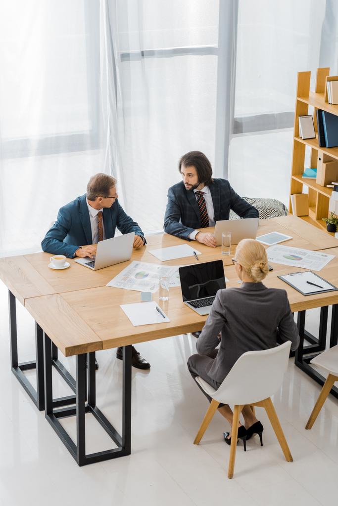 business people sitting at table and having discussion in office  - Photo, Image