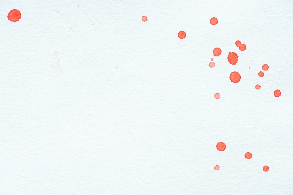 abstract red watercolor drops on white paper background with copy space - Photo, Image