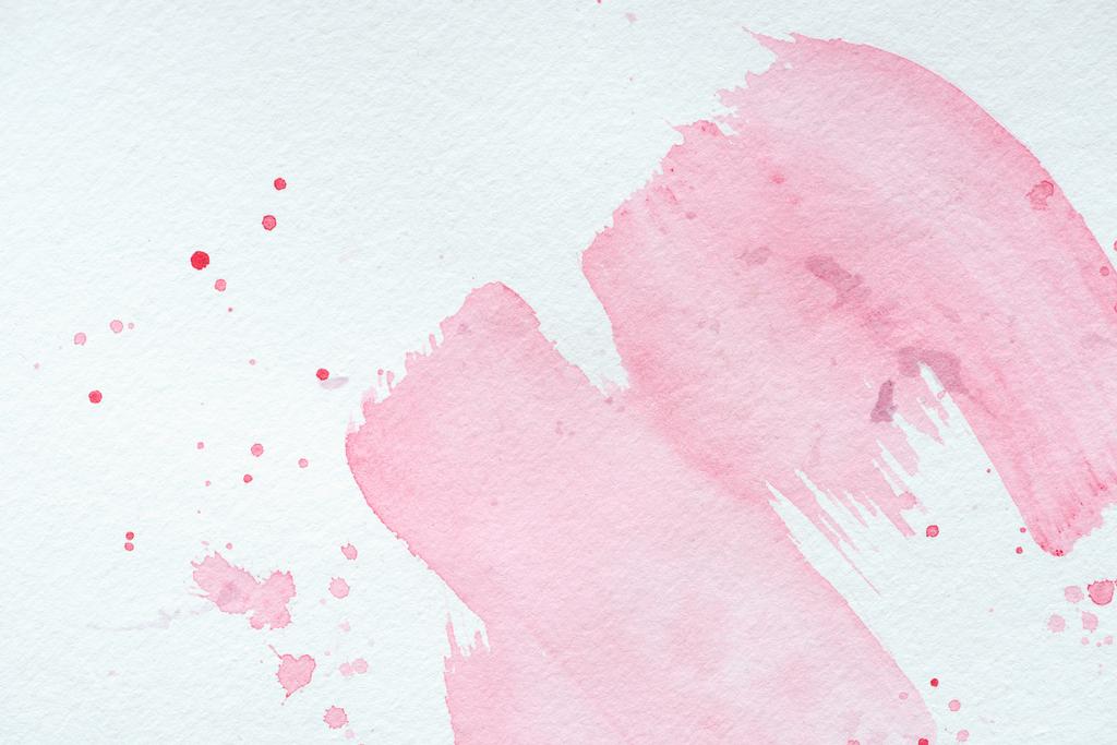 creative background with pink watercolor strokes and splatters on white paper - Photo, Image