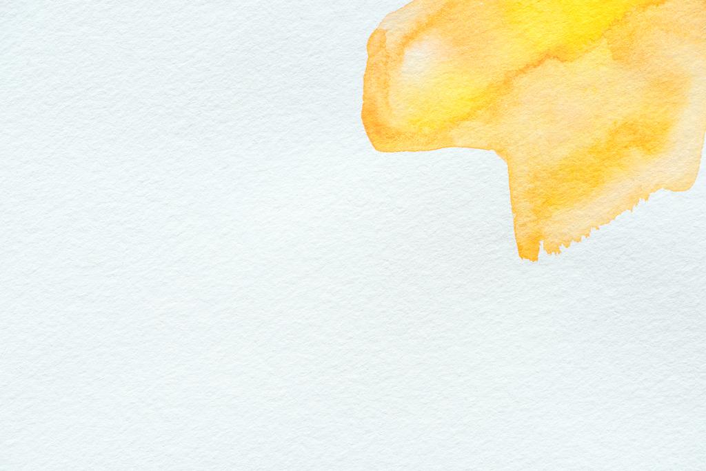 abstract yellow watercolor strokes on white paper background - Photo, Image