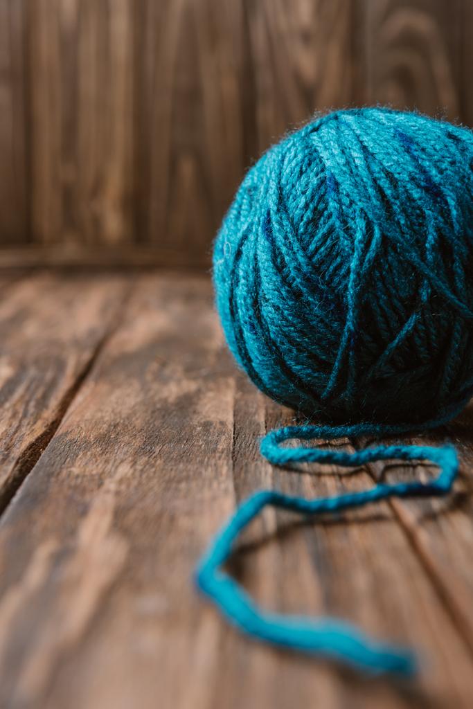 close up view of blue yarn clew on wooden tabletop - Photo, Image