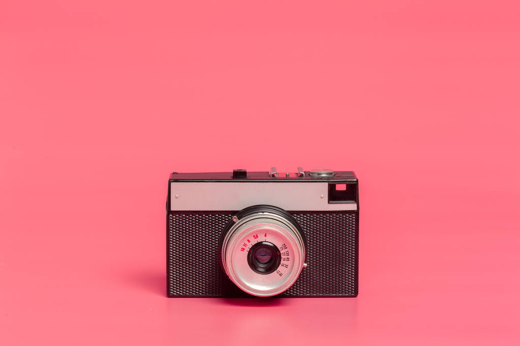 Vintage camera on pink background front view - Photo, Image