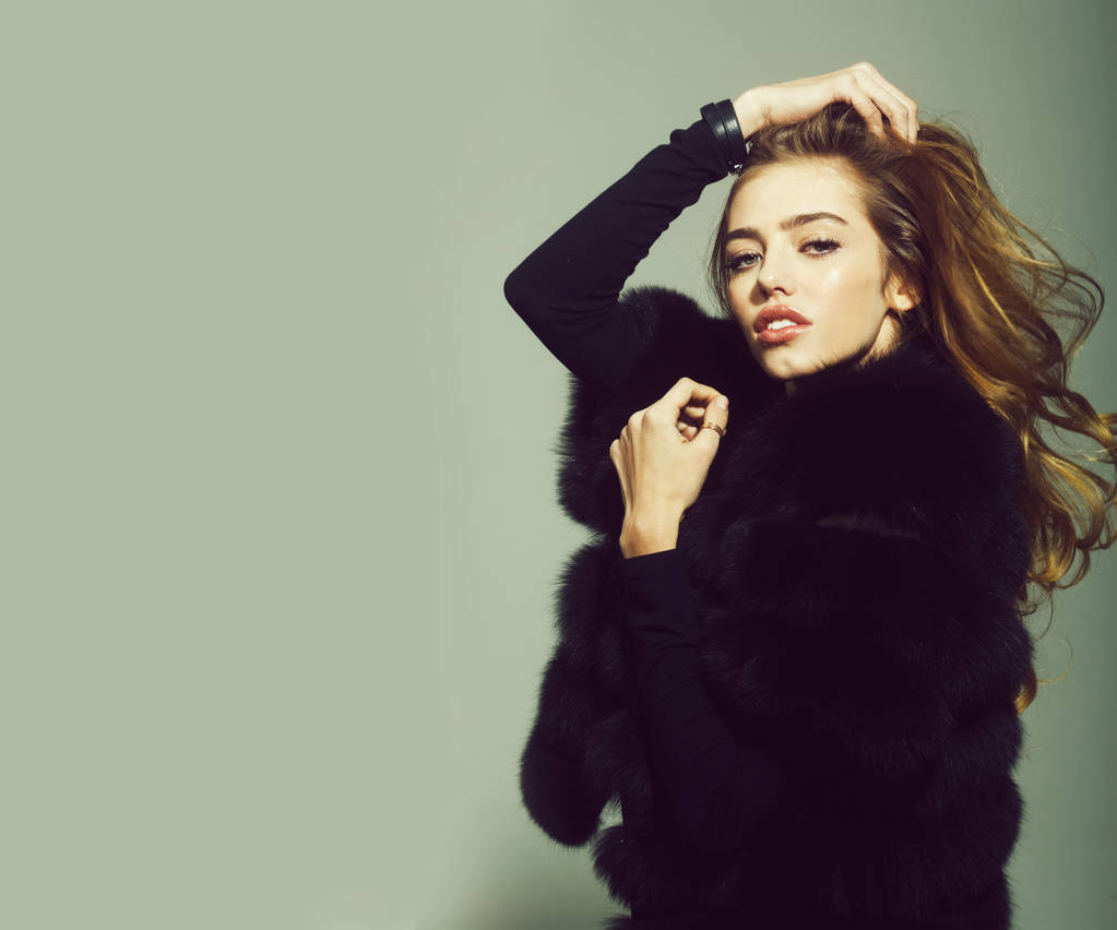 pretty sexy woman or girl with long hair in fur - Photo, Image