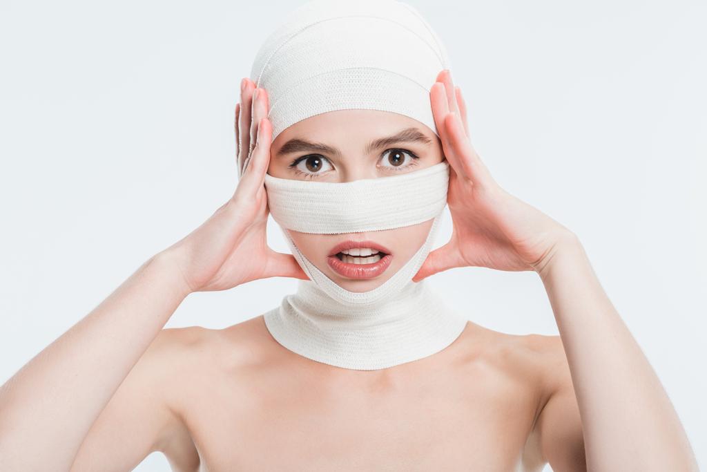 close up of woman with bandages over head after plastic surgery isolated on white - Photo, Image