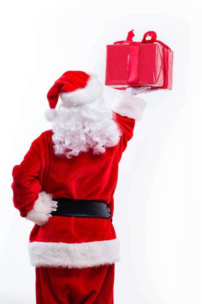 Санта тримає Різдвяний подарунок - Фото, зображення