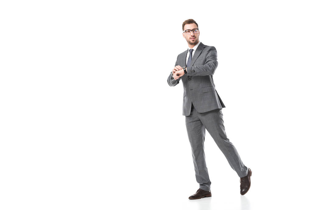 guapo adulto hombre de negocios en gafas con reloj aislado en blanco
 - Foto, imagen