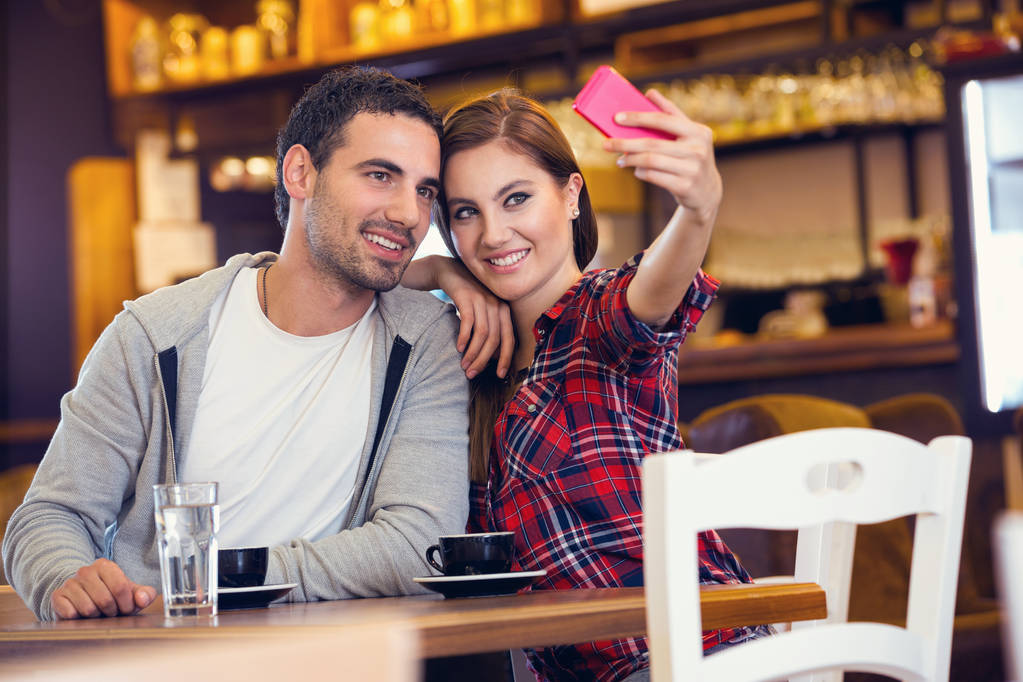 couple taking photo in cafe - Photo, Image