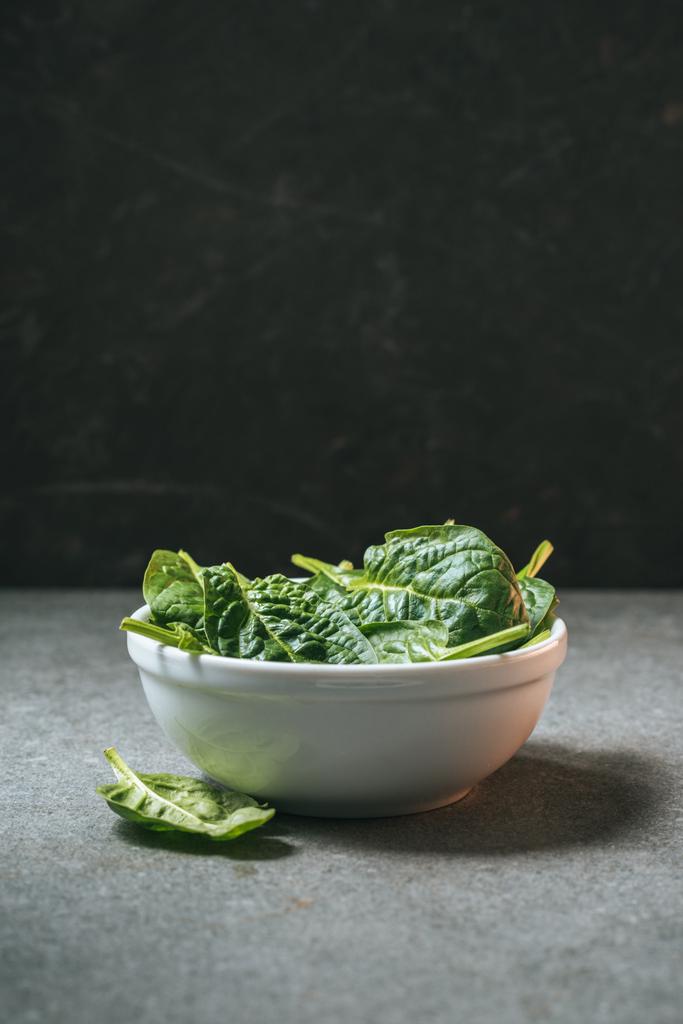 healthy spinach leaves in white bowl with copy space - Photo, Image