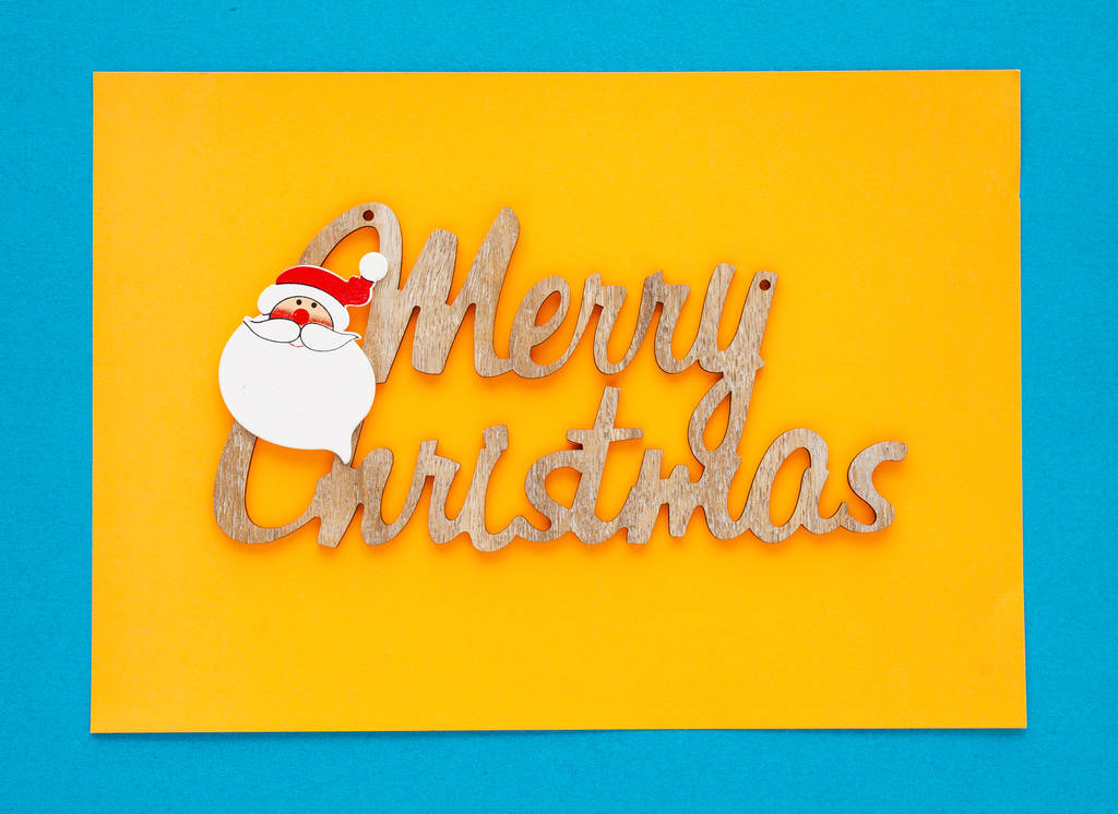 Nézd meg felülről boldog karácsonyt felirat, a színes hátteret, üdvözlőlap, a hely a szöveg írása - Fotó, kép