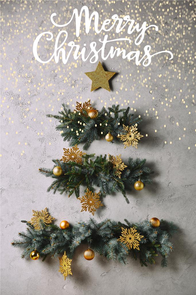 Різдвяна ялинка ручної роботи і зірка, що звисає на сірій стіні з "яскравими різдвяними" ліхтарями
 - Фото, зображення