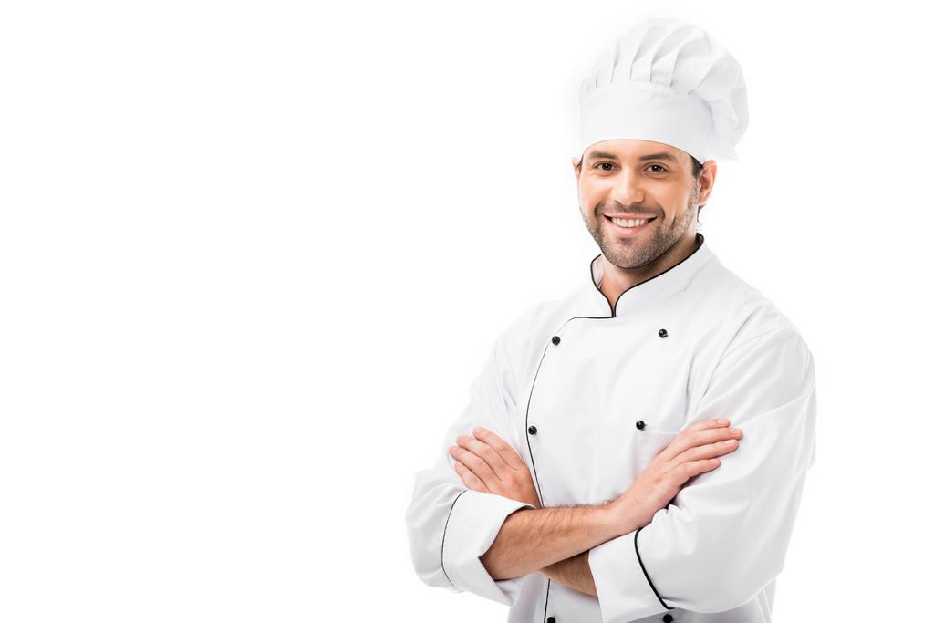 привабливий молодий шеф-кухар з схрещеними руками дивиться на камеру ізольовано на білому
 - Фото, зображення