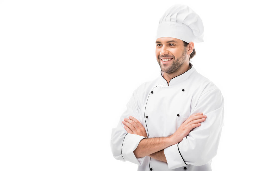guapo joven chef con los brazos cruzados mirando hacia otro lado aislado en blanco
 - Foto, Imagen