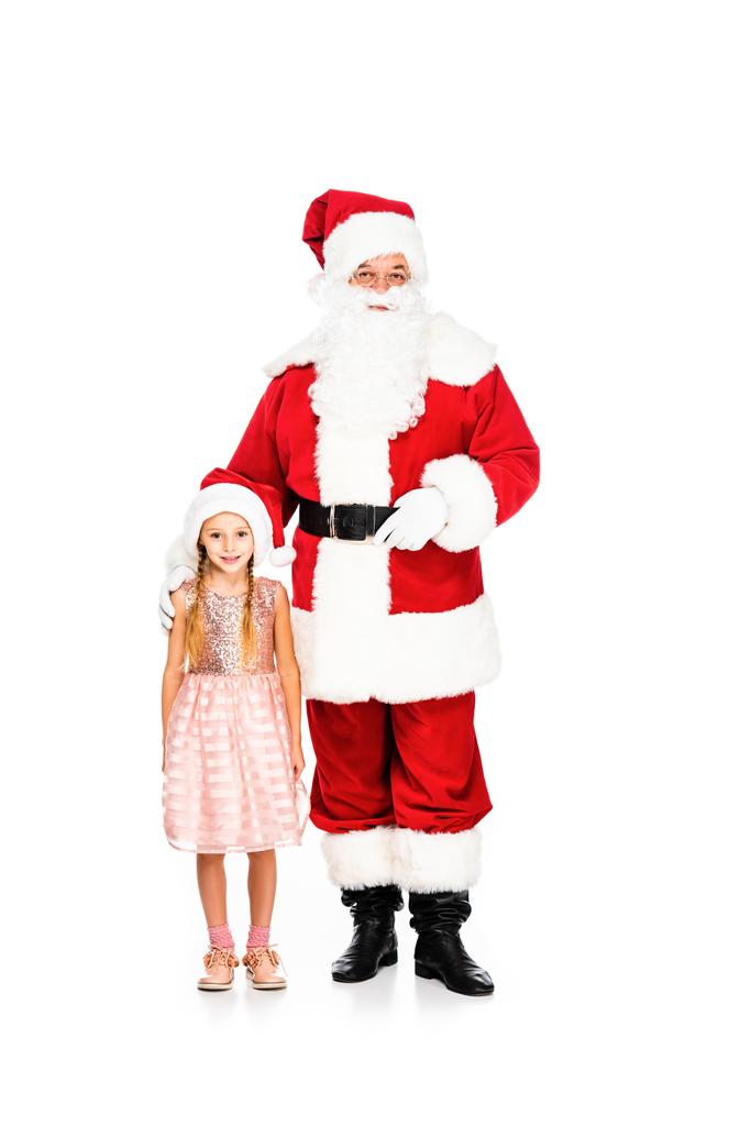 Joulupukki ja pieni lapsi katselee kameraa yhdessä eristyksissä valkoisella
 - Valokuva, kuva