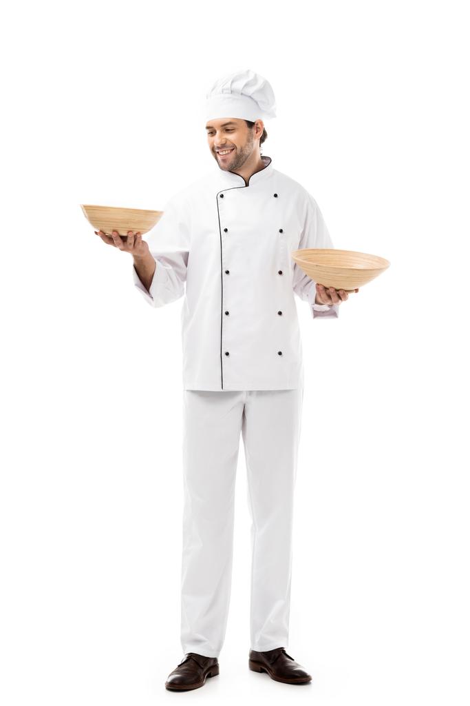 beau jeune chef tenant bols isolés sur blanc
 - Photo, image