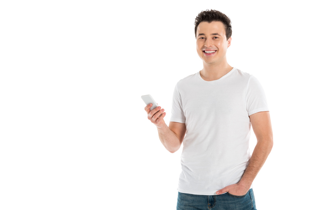 hombre guapo feliz usando teléfono inteligente aislado en blanco
 - Foto, Imagen