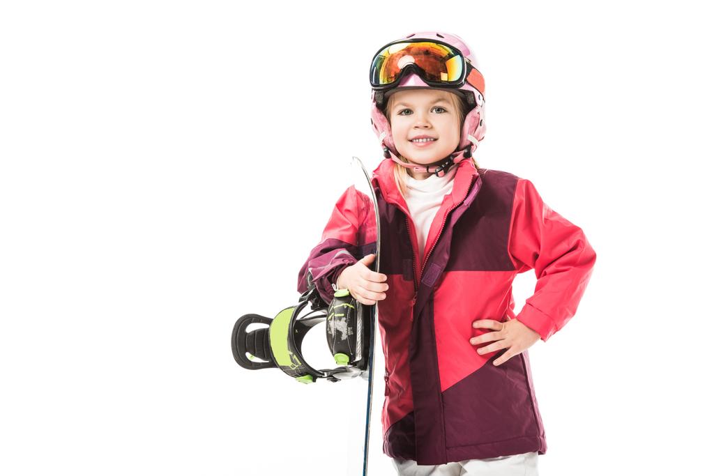Симпатичный дошкольник в лыжном костюме со сноубордом, улыбающийся изолированно на белом
 - Фото, изображение