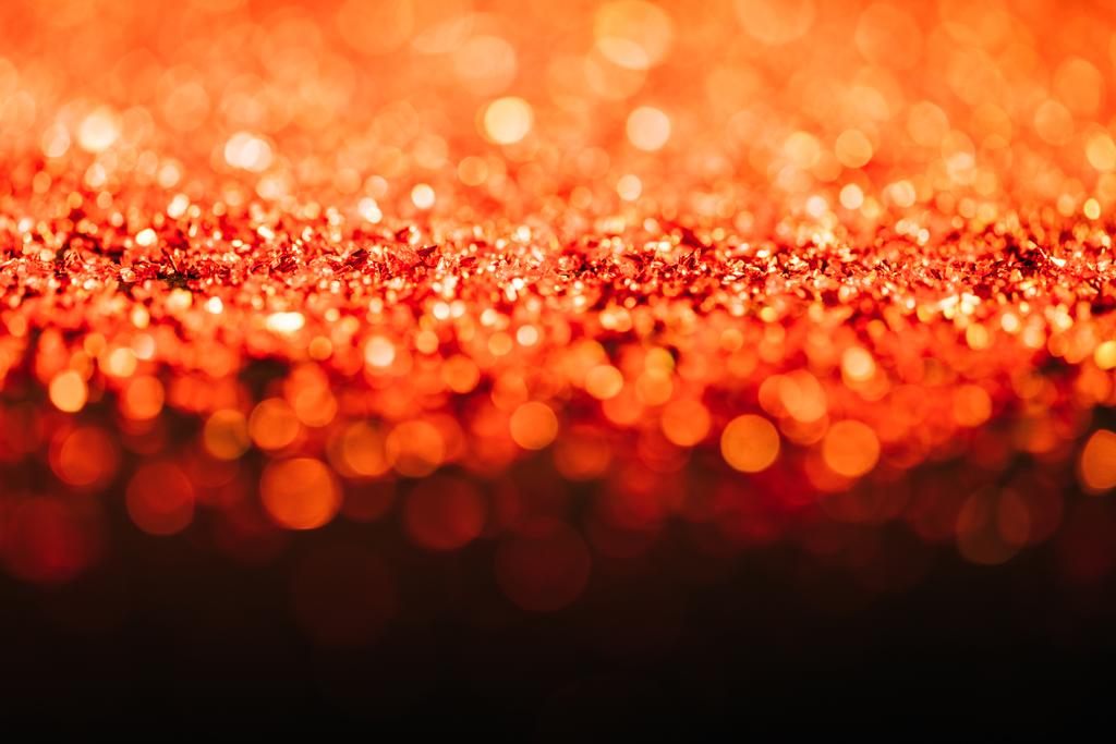 glowing christmas texture with red defocused glitter  - Photo, Image