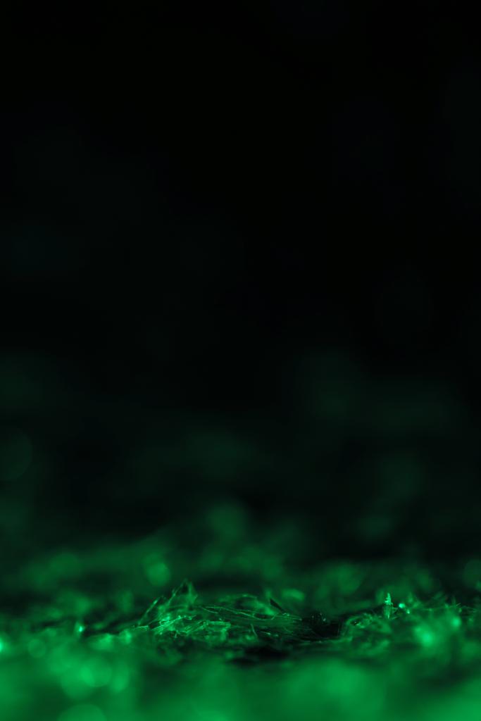 Green Glitter On Black Background With Copy Free Stock Photo and Image