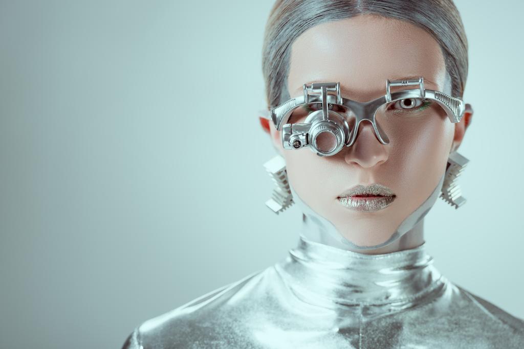close-up view of silver robot looking at camera isolated on grey, future technology concept  - Photo, Image
