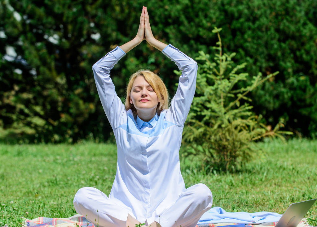 Clear your mind. Girl meditate on rug green grass meadow nature background. Woman relaxing practicing meditation. Every day meditation. Reasons you should meditate every day. Find minute to relax - Photo, Image