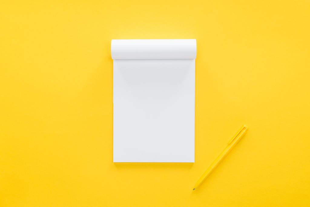 top view of blank notebook on yellow background - Photo, Image
